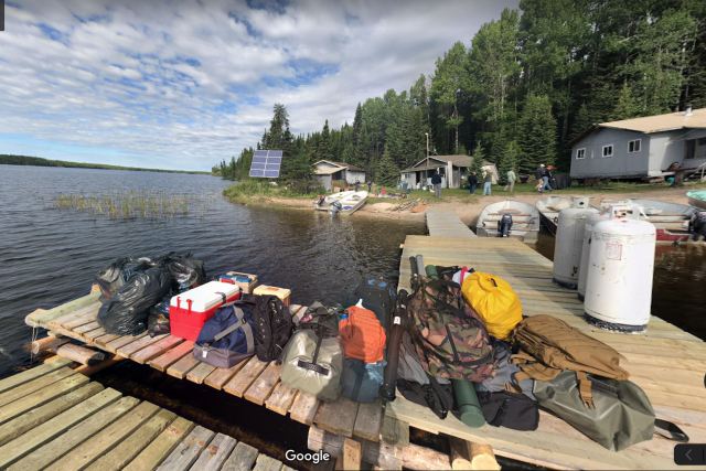 Dock with luggage, lake in manitoba